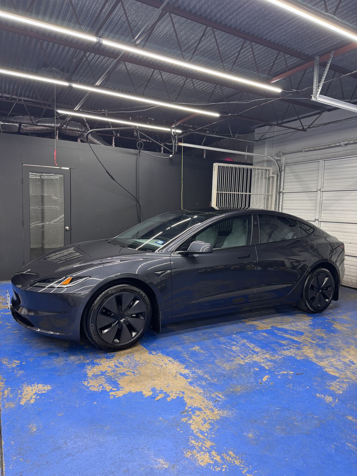 Black Tesla Model 3 ceramic coating at ShineLab studio, San Antonio